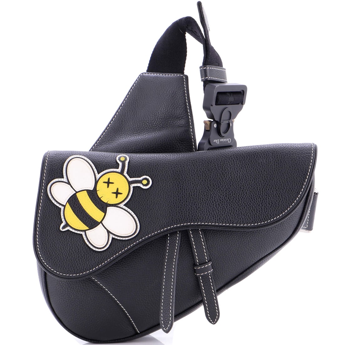 Christian Dior KAWS Saddle Crossbody Bag: The Christian Dior KAWS Saddle Crossbody Bag proves that refinement and personality are not mutually exclusive. Luxury, with just enough mischief.