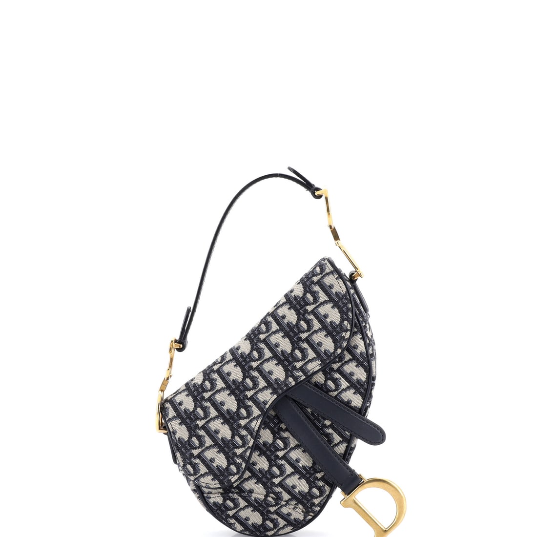 Christian Dior Saddle Handbag: The Christian Dior Saddle Handbag proves that refinement and personality are not mutually exclusive. Charming, composed, and entirely in on the joke.