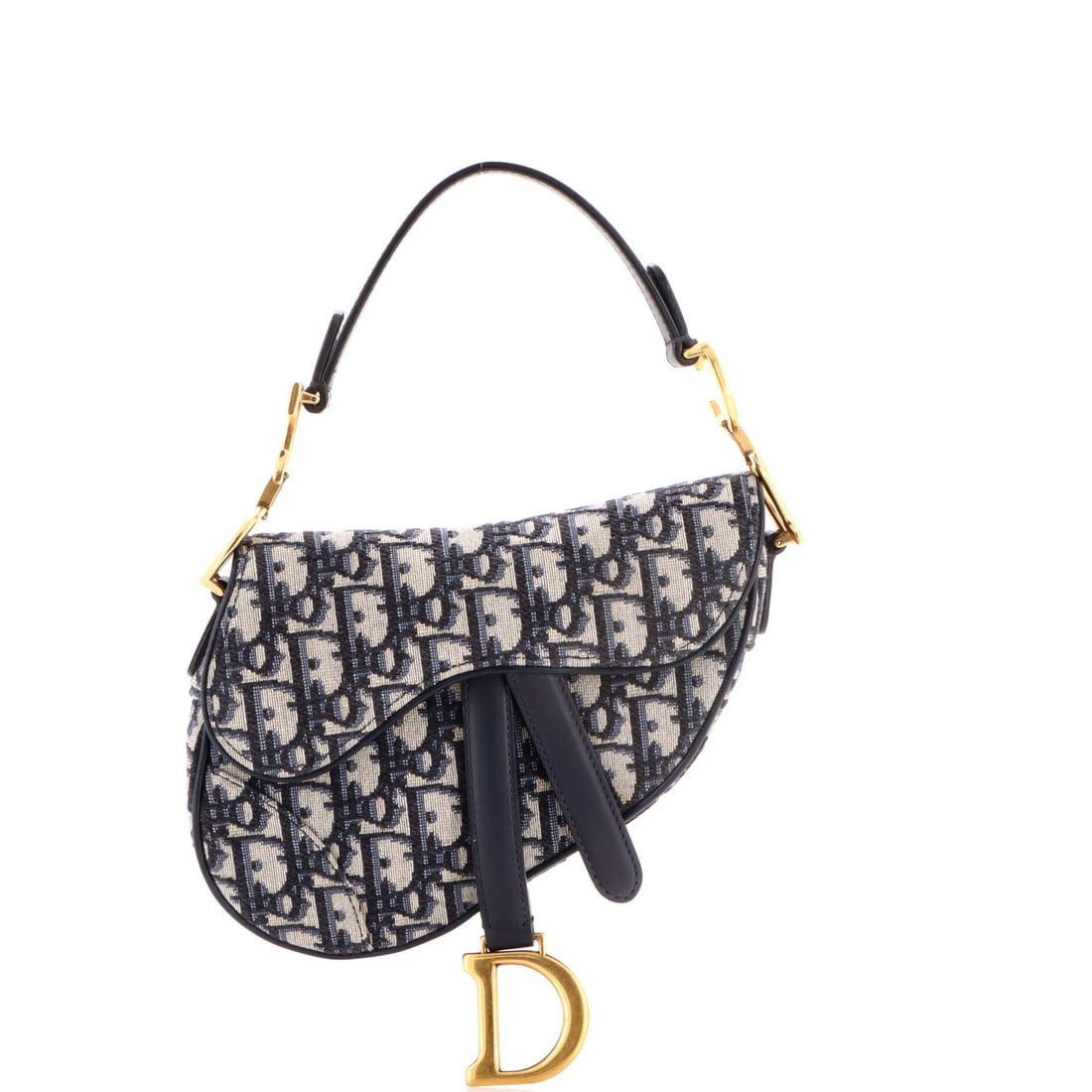 Christian Dior Saddle Handbag: Equal parts polish and personality, the Christian Dior Saddle Handbag refuses to be forgettable. It has that rare ability to feel timeless and entirely current at once. Luxury, with just enough mischi