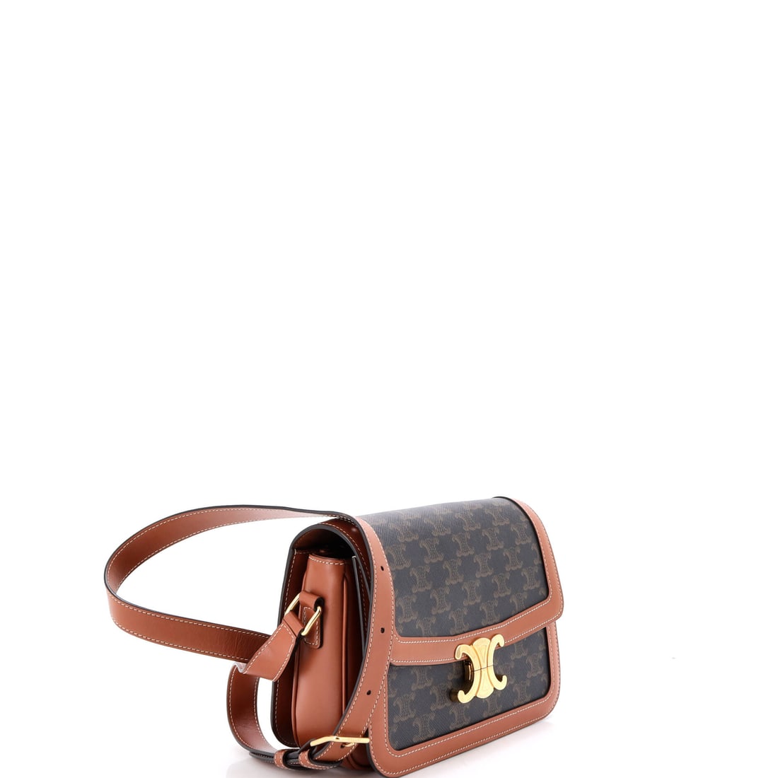 Celine Triomphe Shoulder Bag Triomphe Coated Canvas Medium: Lot 76 channels the kind of quiet icon status Celine does best. Offered here as Celine Celine Triomphe Shoulder Bag Triomphe Coated Canvas Medium, finished in Brown; approx. 8.5 W x 6.0 H; 3.0 D. Thin