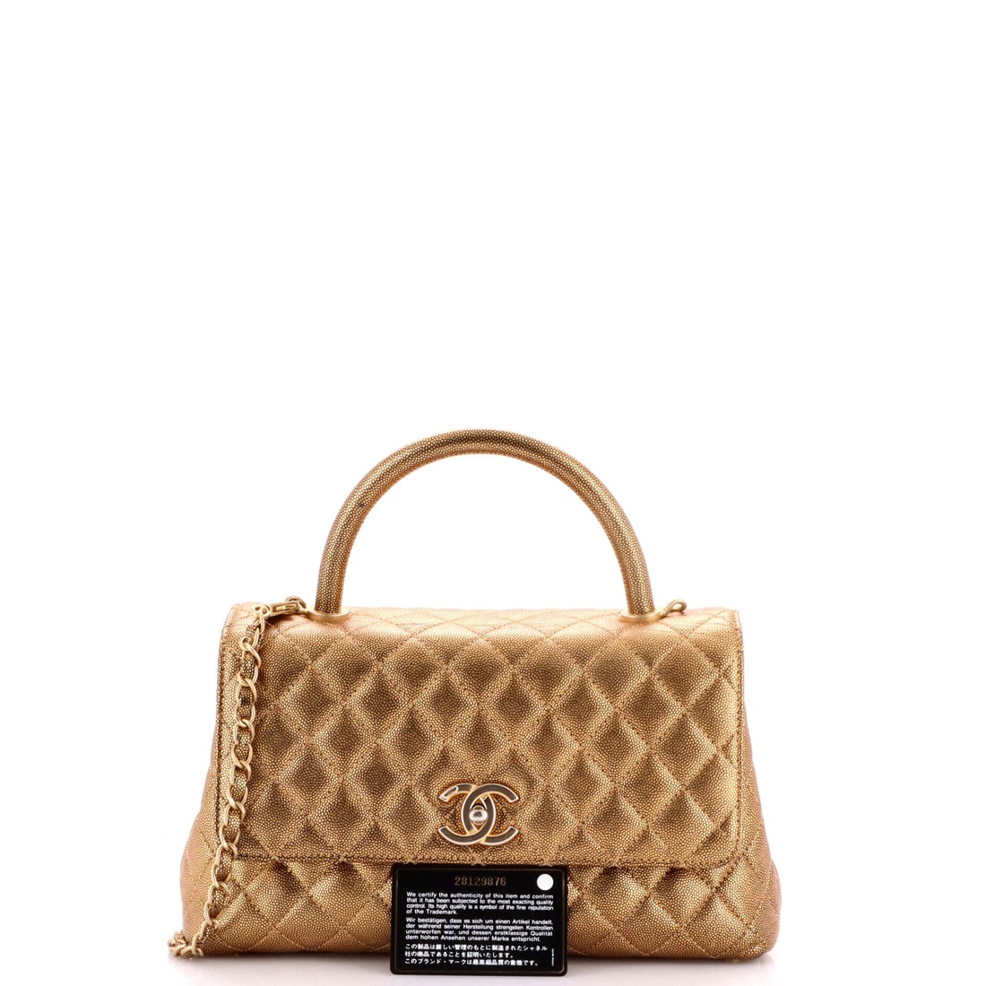Chanel Coco Top Handle Bag Quilted Caviar Small: Lot 115 is an easy yes for anyone building a tight luxury edit. Offered here as Chanel Chanel Coco Top Handle Bag Quilted Caviar Small, finished in Gold; approx. 11.0 W x 7.5 H; 5.0 D. Equal parts pra