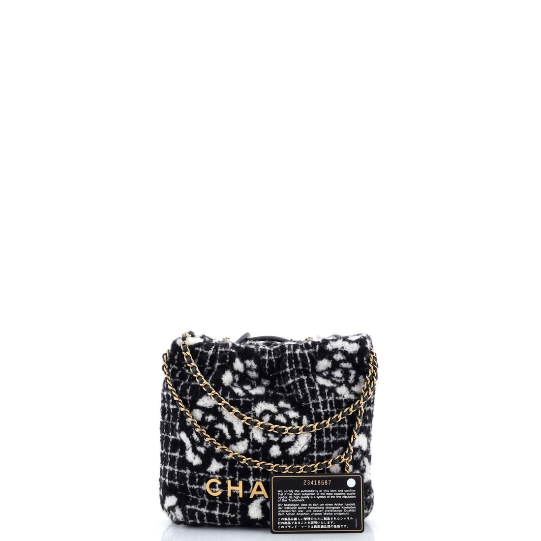 Chanel 22 Chain Hobo Quilted Camellia Cashmere Mini: Lot 127 is the finishing touch that pulls everything together. Offered here as Chanel Chanel 22 Chain Hobo Quilted Camellia Cashmere Mini, finished in Black, Print, White; approx. 8.0 W x 7.0 H; 2.5 D