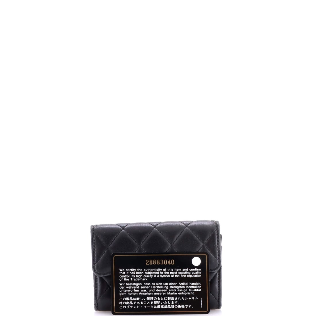 Chanel Classic Flap Card Case Quilted Lambskin: Lot 194 does not whisper - it purrs, struts, and gets noticed. Offered here as Chanel Chanel Classic Flap Card Case Quilted Lambskin, finished in Black; approx. 4.5 W x 3.0 H; 1.0 D. A strong piece fo