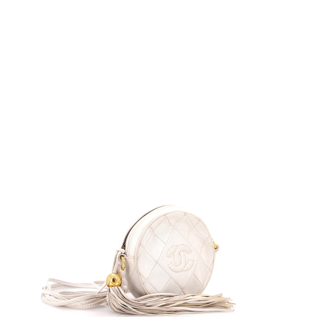 Chanel Vintage Round Tassel Crossbody Bag Quilted Leather Mini: Lot 197 belongs on your arm for dinner, then straight to the afters. Offered here as Chanel Chanel Vintage Round Tassel Crossbody Bag Quilted Leather Mini, finished in White; approx. 5.0 W x 5.0 H; 1.