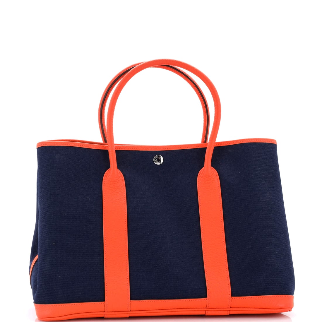 Hermes Garden Party Tote Toile and Leather 36: Lot 483 gets the proportions exactly right - confident, clean, and considered. Offered here as Hermes Hermes Garden Party Tote Toile and Leather 36, finished in Blue, Orange; approx. 14.0 W x 10.0 H;