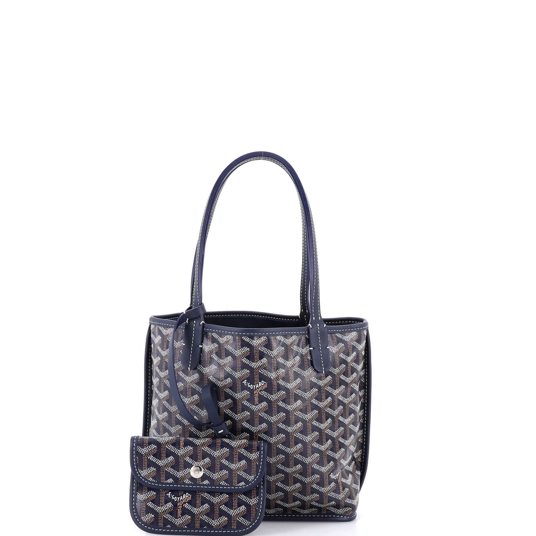 Goyard Anjou Reversible Tote Coated Canvas Mini: Precise where it matters, relaxed where it counts: the Goyard Anjou Reversible Tote Coated Canvas Mini in Blue is a study in considered proportion. This compact Coated Canvas, Canvas tote pairs the hi
