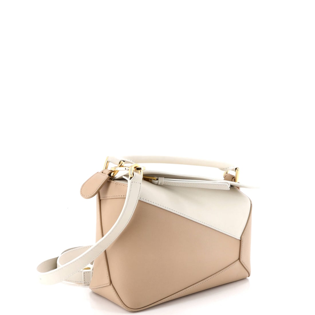 Loewe Puzzle Bag Leather Small: A Loewe Puzzle Bag Leather Small in Neutral does not require an occasion -- it creates one. This small-scale Leather bag is the work of the Spanish leather atelier at its most self-assured, finished i