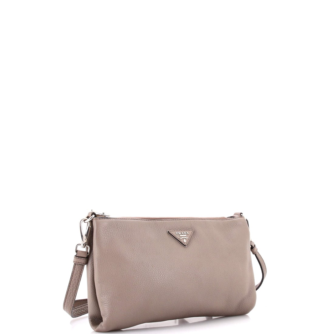 Prada Flat Zip Crossbody Bag Vitello Daino Mini: The Prada Flat Zip Crossbody Bag Vitello Daino Mini: proof that the best things in life reward patience and discernment. This compact crossbody bag arrives in Gray in fine materials, delivering the qu