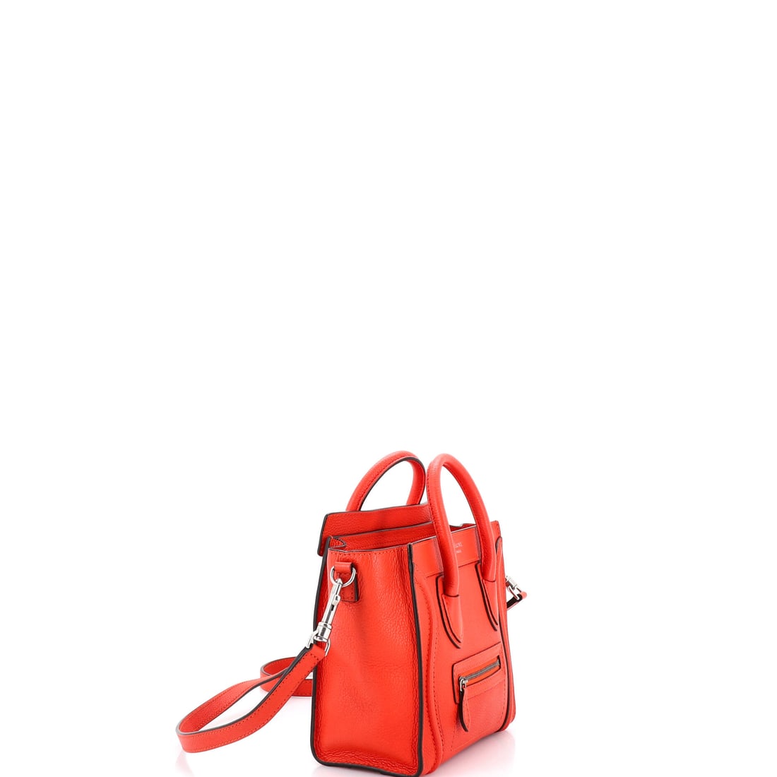 Celine Luggage Bag Smooth Leather Nano: Some accessories whisper; this one holds court. The Celine Luggage Bag Smooth Leather Nano arrives in a striking Red leather finish (size Nano). With dimensions of 8" x 8" x 4", it carries more than