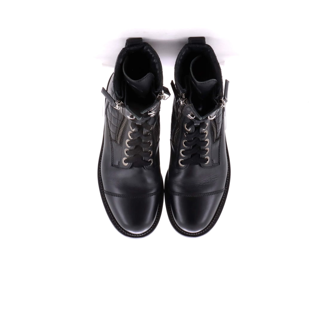 Chanel Women's CC Zip Up Combat Boots Quilted Leather: For the collector of exceptional footwear. This particular Chanel Women's CC Zip Up Combat Boots Quilted Leather features a Black leather quilted exterior.