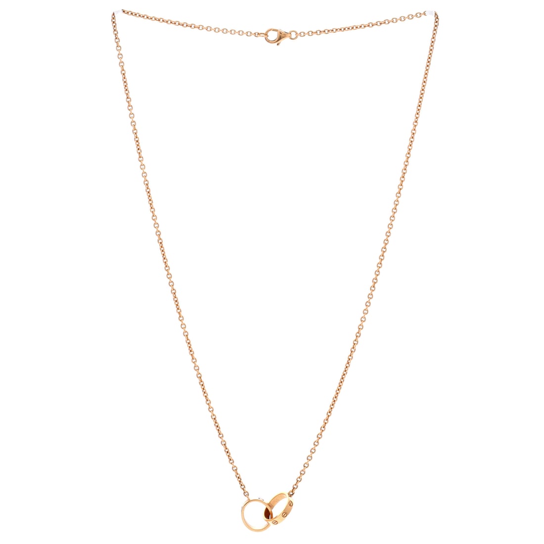 Cartier Love Interlocking Necklace 18K Rose Gold: The smallest details carry the heaviest elegance. This is Cartier at their most poetic -- restrained, resonant, and effortlessly refined. Presented in 18k rose gold construction, a rose gold colorway.
