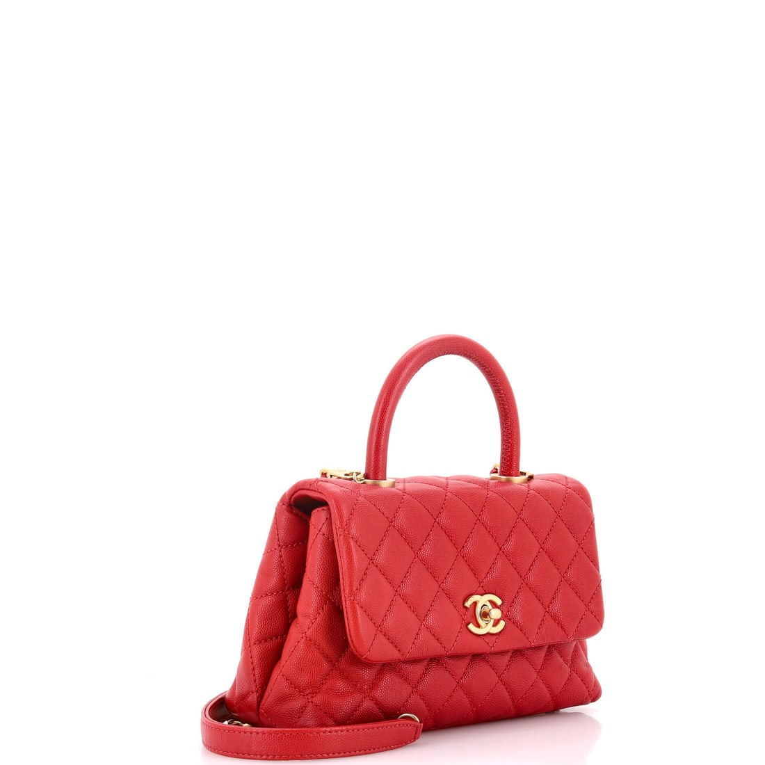 Chanel Coco Top Handle Bag Quilted Caviar Mini: The smallest details carry the heaviest elegance. The Coco Top Handle Bag in this particular shade of Red carries an almost meditative elegance. Presented in the Mini size, quilted caviar construction