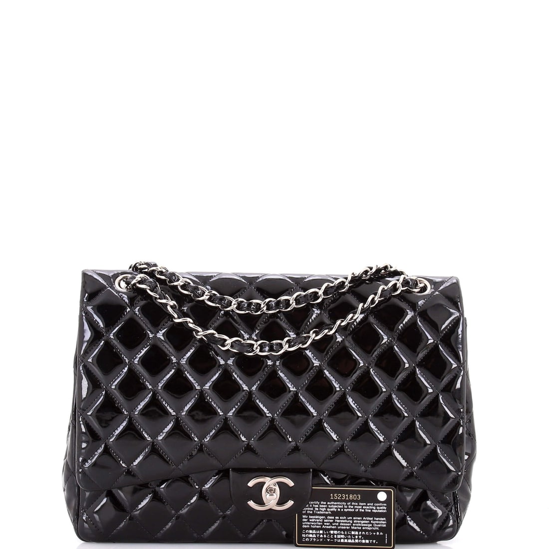 Chanel Classic Double Flap Bag Quilted Patent Maxi: A manifesto in hardware and leather. Read it and weep. The Chanel Classic Double Flap Bag Quilted Maxi is a declaration of intent wrapped in Patent. Presented in patent construction, a black colorway.