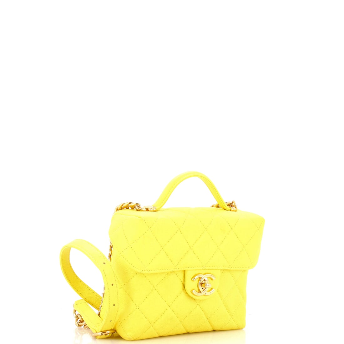 Chanel Handy Box Vanity Case Quilted Caviar: Elegance distilled to its most essential gesture. The Chanel Handy Box Vanity Case in Yellow Quilted Caviar unfolds like a story told in whispers. Presented in quilted caviar construction, a yellow co