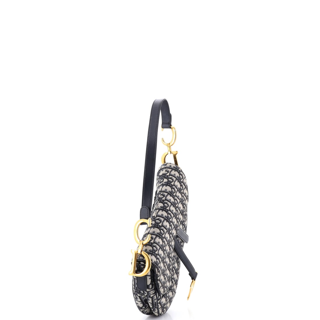 Christian Dior Saddle Handbag Oblique Canvas Medium: The provenance of this design traces back to hallowed ground. The Christian Dior Saddle Handbag represents a chapter in the house's ongoing dialogue between form and function. Presented in the Medium