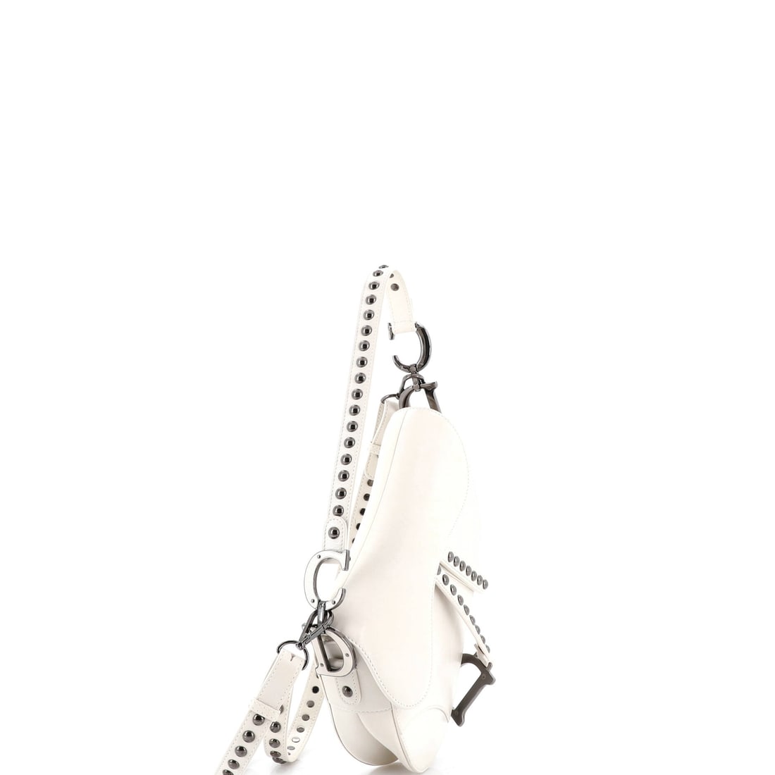 Christian Dior Saddle Handbag with Strap Studded Leather Medium: Some carry a bag. This bag carries a reputation. The Christian Dior Saddle Handbag with Strap Studded is a declaration of intent wrapped in Leather. Presented in the Medium size, leather