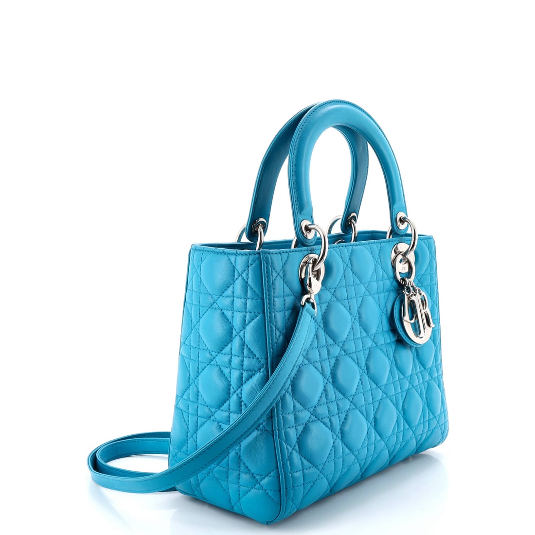 Christian Dior Lady Dior Bag Cannage Quilt Lambskin Medium: When the atelier doors close, only the finest work emerges. The Blue Lambskin finish elevates an already iconic Christian Dior silhouette to collector status. Presented in the Medium size, lambskin co