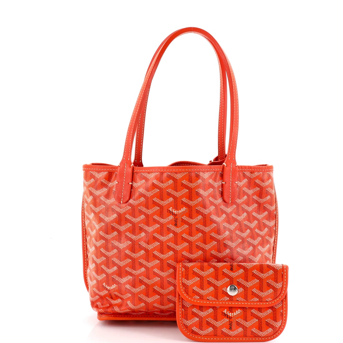 Goyard Anjou Reversible Tote Coated Canvas Mini: Your wardrobe has been waiting for exactly this. In Orange Coated Canvas, this Anjou Reversible Tote transitions seamlessly from boardroom to bar. Presented in the Mini size, coated canvas constructio