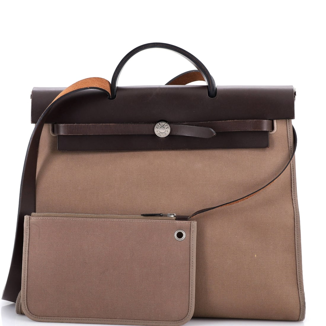 Hermes Herbag Zip Leather and Toile 39: Go ahead -- try to ignore it. We will wait. The Hermes Herbag Zip and Toile 39 in Brown Leather is not asking for permission -- it is making a statement. Presented in leather construction, a brown col