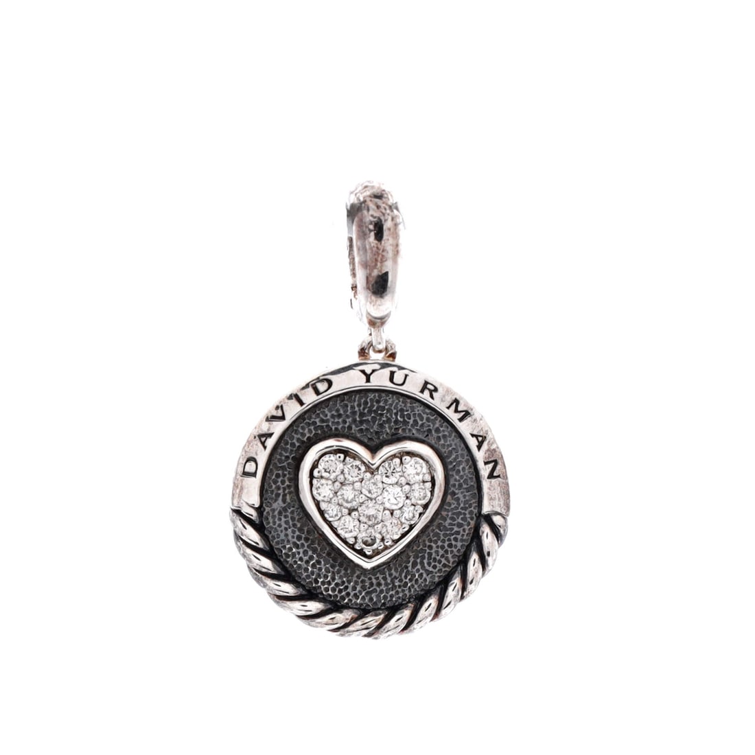 Silver David Yurman Heart Circle Pendant: A creation shaped by atelier memory and masterful hands, the Silver David Yurman Heart Circle Pendant embodies the quiet prestige of true luxury. A piece that transitions from the Carlyle to the Conco