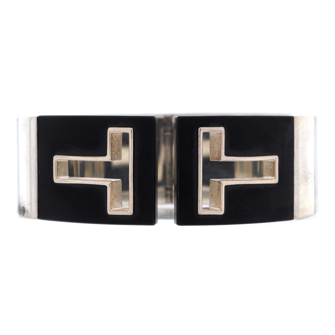 Silver Tiffany & Co. T Cut-Out Cuff Bracelet: Smart, polished, and ready for anything -- the Silver Tiffany & Co. T Cut-Out Cuff Bracelet works as hard as you do. A piece designed for the woman who makes plans, not excuses. Crafted for the long g