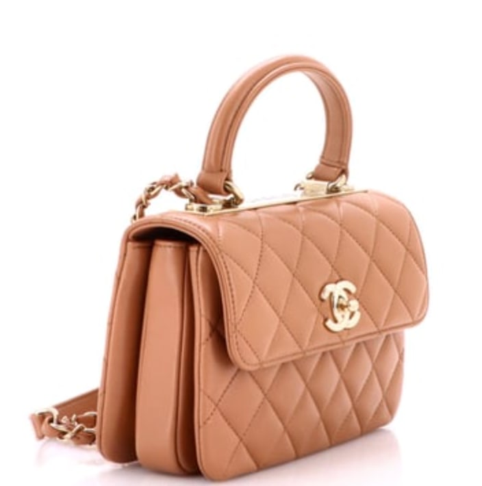 Chanel Trendy CC Top Handle Bag Quilted Lambskin Small: Some accessories whisper; this one holds court. The Trendy CC Top Handle Bag Quilted Lambskin Small by Chanel in Brown lambskin quilted (size Small) needs no embellishment. Measuring 6" H x 9" W x 5" 