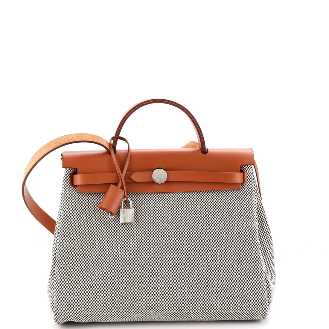 Hermes Herbag Zip Criss Viking Toile and Leather (31): At a 12 by 10 by 4 inch profile, the Hermes Herbag Zip in Criss Viking Toile and Leather offers the silhouette in its most photographed proportion. Toile is the tightly woven cotton-and-linen canvas H