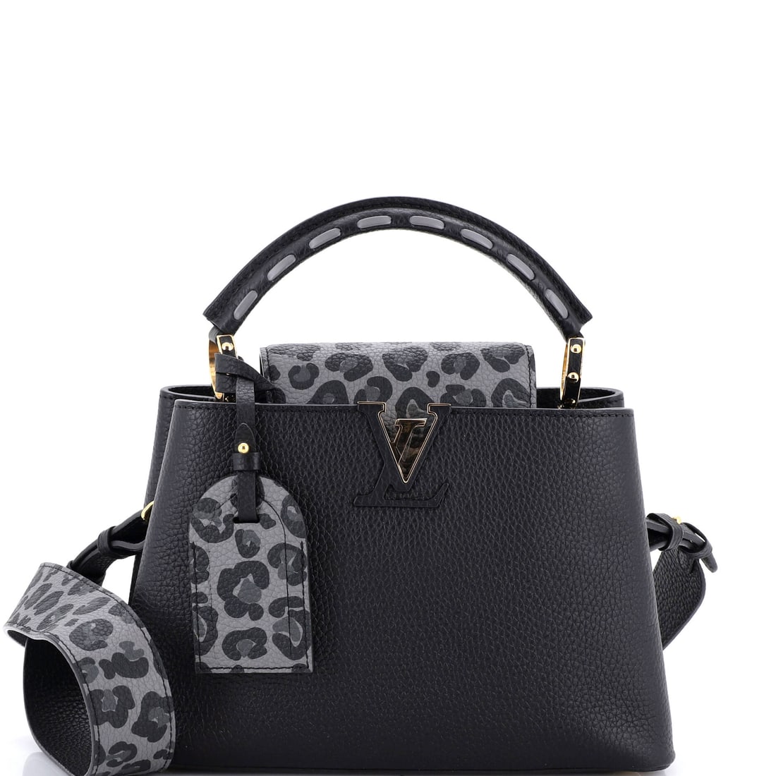 Louis Vuitton Capucines Bag Wild at Heart Leopard Print Taurillon Leather (BB): The Louis Vuitton Capucines BB in the Wild at Heart leopard print Taurillon - Taurillon being Vuitton's textured, full-grain calfskin developed for the Capucines line - offers the model in its most ed