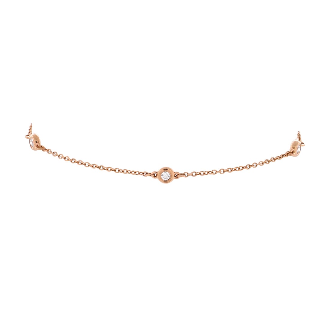 Tiffany & Co. Elsa Peretti Diamonds by the Yard 3 Stone Bracelet 18K Rose Gold with Diamonds: The Tiffany & Co. Elsa Peretti Diamonds by the Yard 3 Stone Bracelet in 18K Rose Gold with Diamonds renders the house's signature into a piece sized for everyday layering and evening volume in equal m