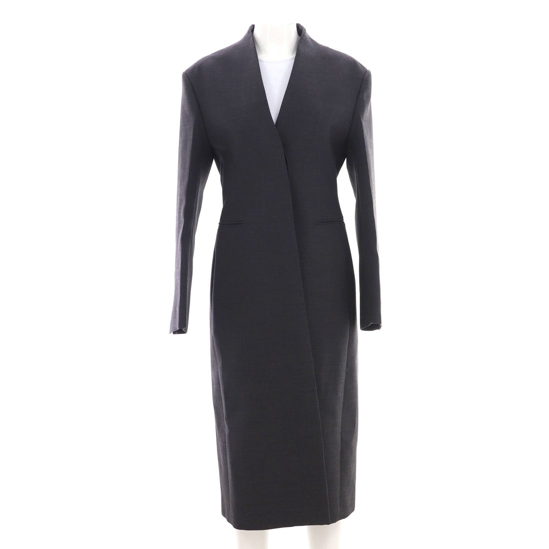 Salvatore Ferragamo Women's Single Breasted Long Coat Wool (L | IT 44): The Salvatore Ferragamo Women's Single Breasted Long Coat in Wool carries the model's silhouette at a proportion built for daily wear in size L | IT 44. Wool is one of the more reliable materials in t
