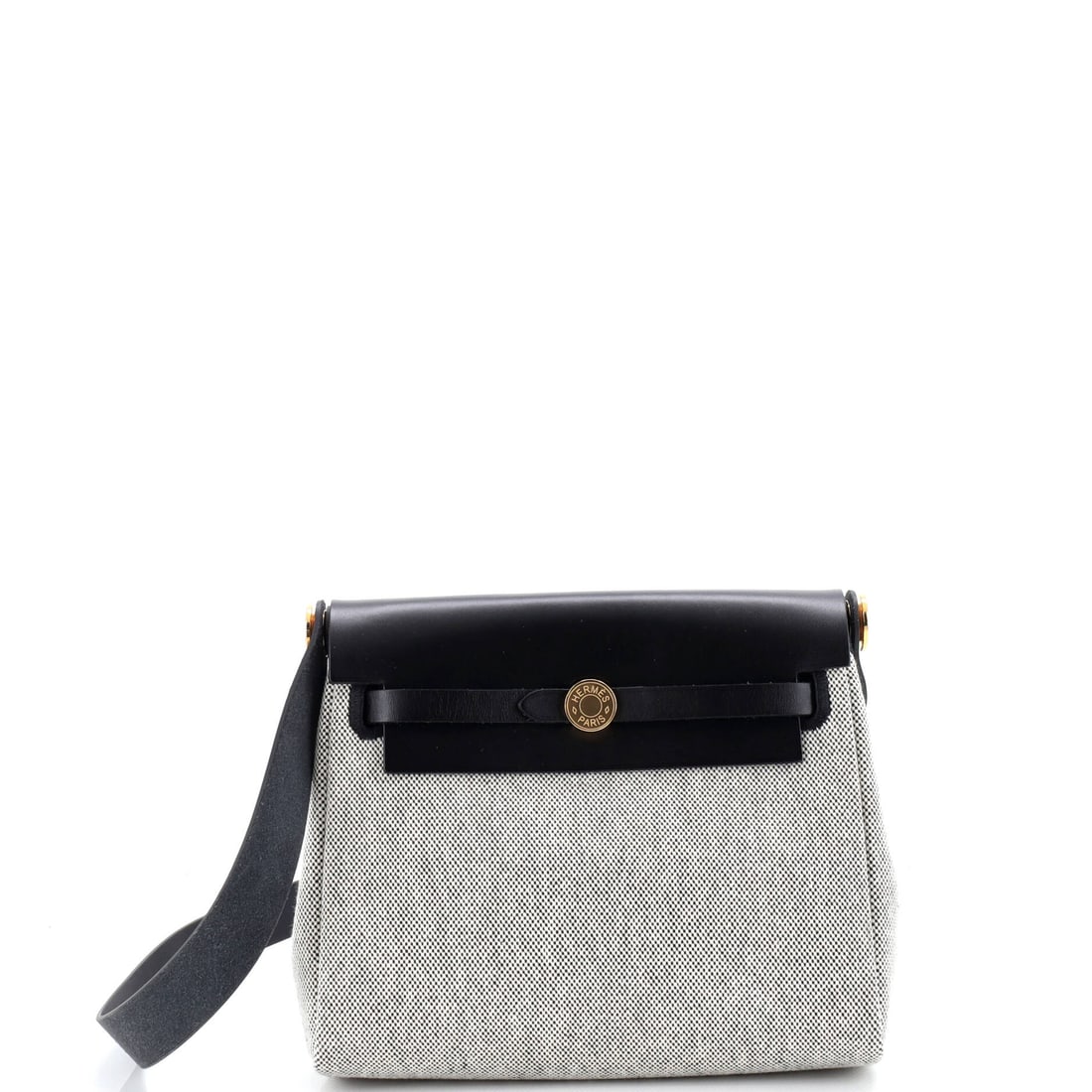 Hermes Herbag Zip Toile and Leather (20): The Hermes Herbag Zip in Toile and Leather holds its line where the seasonal bags soften, the kind of construction the house quietly built its reputation on. Toile is the tightly woven cotton-and-line