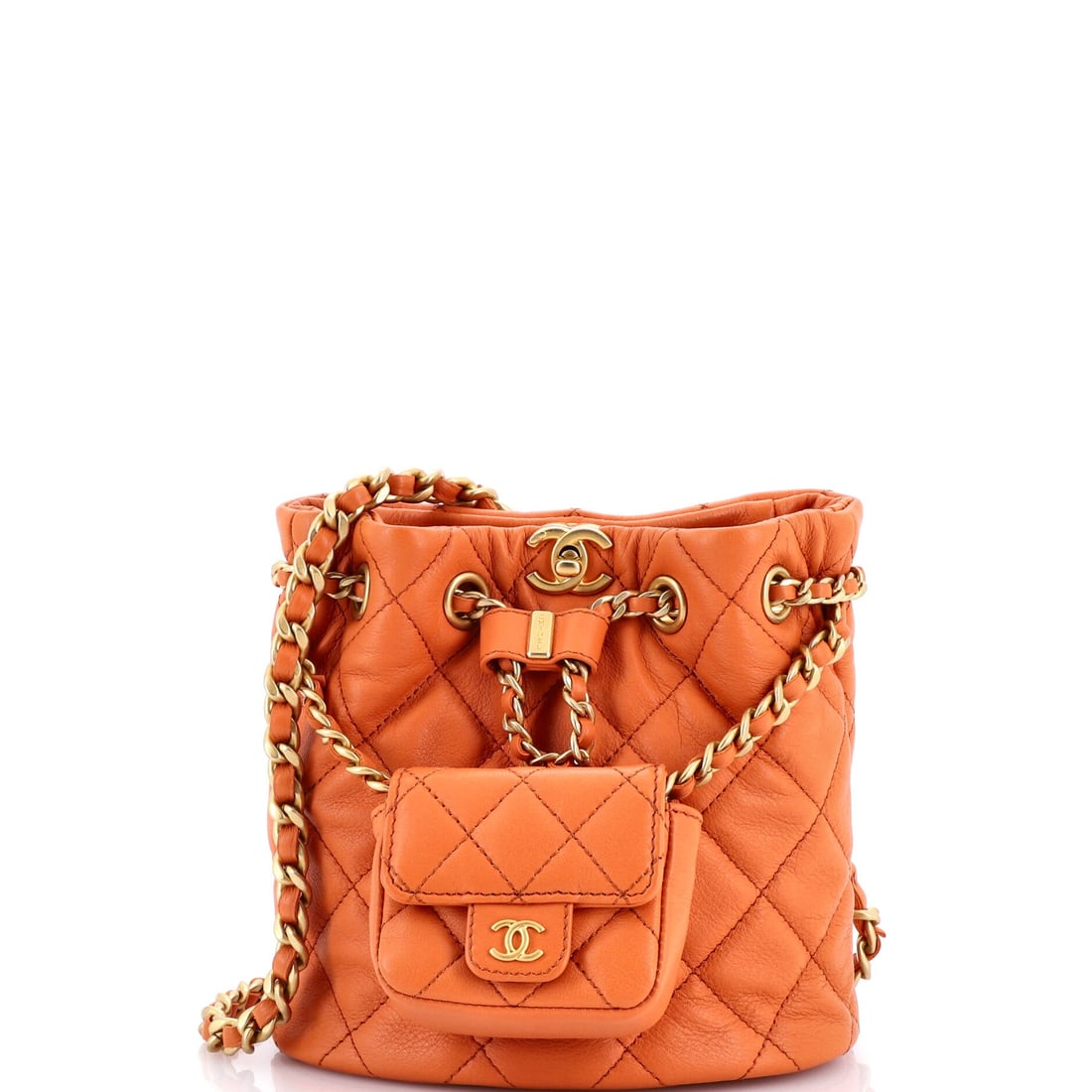 Chanel CC Pocket Chain Bucket Backpack Quilted Lambskin (Small): The Chanel CC Pocket Chain Bucket Backpack renders the model's silhouette in Quilted Lambskin, in size Small, with the line holding cleanly across the body. Lambskin is the softer, more luminous of Ch