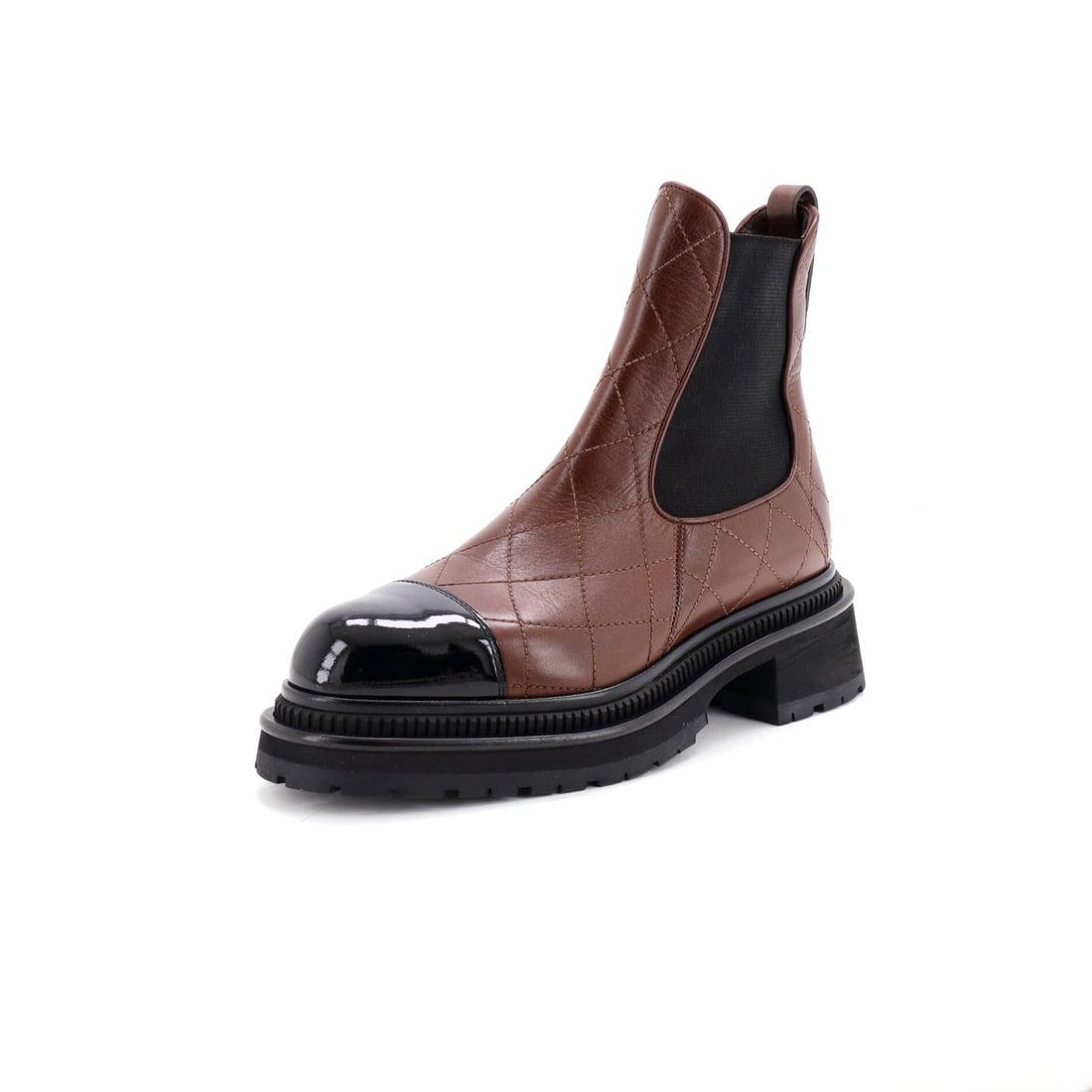 Chanel Women's Cap Toe Chelsea Ankle Boots Quilted Leather with Patent (US(W) 8 | IT 38): The Chanel Women's Cap Toe Chelsea Ankle Boots in Quilted Leather with Patent sits squarely in the house's after-six register in size US(W) 8 | IT 38. Quilted Leather with Patent is the most editorial