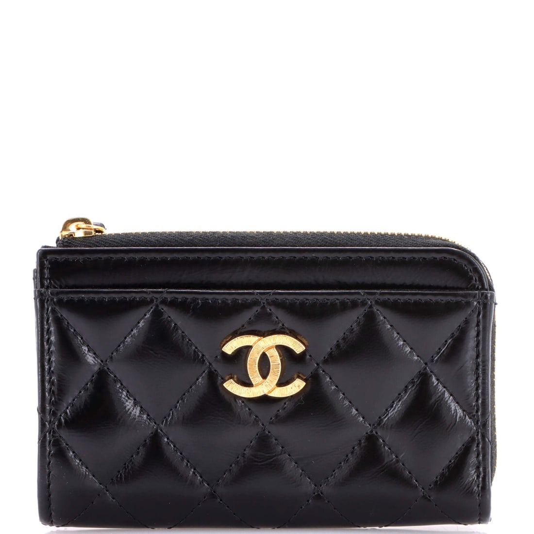 Chanel Textured CC Zip Around Card Holder Quilted Lambskin (5"W x 3.5"H x 0.5"D): The Chanel Textured CC Zip Around Card Holder in Quilted Lambskin reads as the kind of small leather good a wardrobe carries inside its bag rather than alongside it. Lambskin is the softer, more lumin