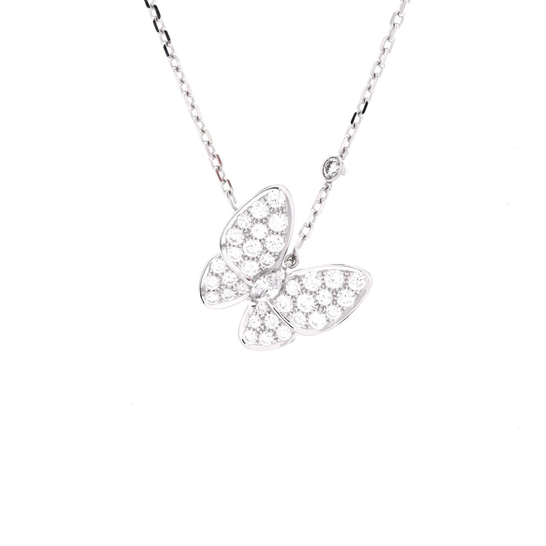 Van Cleef & Arpels Two Butterfly Pendant Necklace 18K White Gold and Diamonds: The Van Cleef & Arpels Two Butterfly Pendant Necklace in 18K White Gold and Diamonds carries the model's signature with the calm of a piece designed to be worn rather than displayed. The metalwork sit