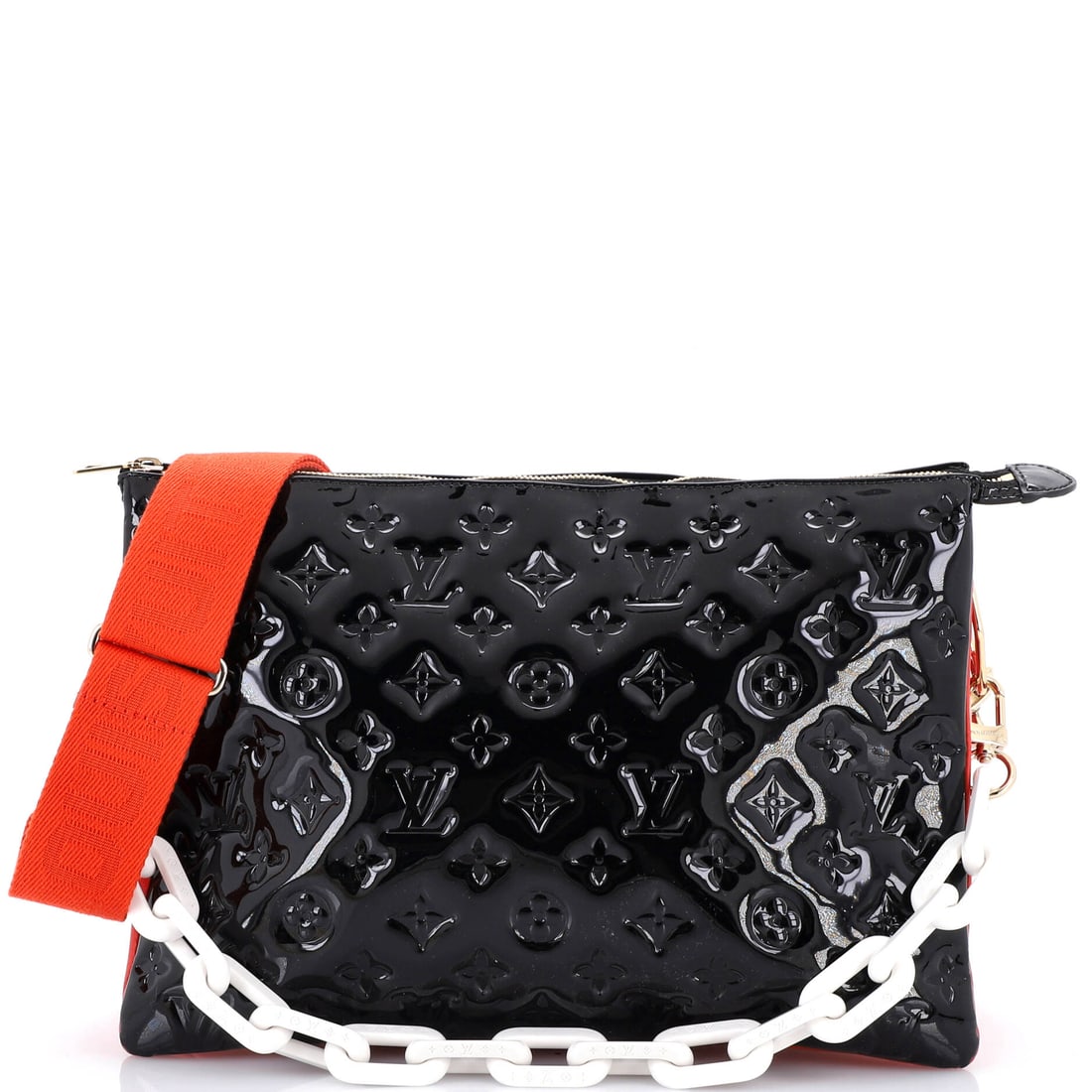 Louis Vuitton Coussin Bag Monogram Embossed Patent (MM): The Louis Vuitton Coussin Bag, here in Monogram Embossed Patent, in size MM, holds its shape against use rather than softening to it. The monogram embossed patent hand falls between the softer slouch 