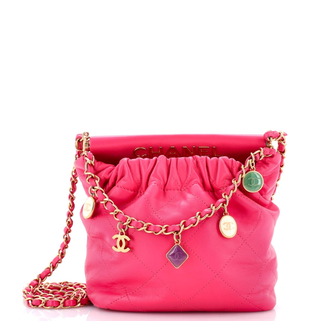 Chanel Resin Charms Chain Bucket Bag Quilted Lambskin (Small): The Chanel Resin Charms Chain Bucket Bag in Quilted Lambskin translates the model's architecture into a more saturated wardrobe register, in size Small. Lambskin is the softer, more luminous of Chanel