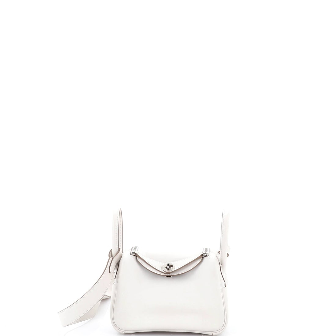 Hermes Lindy Bag Verso Swift (Mini): The Hermes Lindy Bag, in Verso Swift, in size Mini, offers the model in one of its more architecturally satisfying scales. Swift is Hermes's fine, smooth calfskin, light in the hand and the variant mo