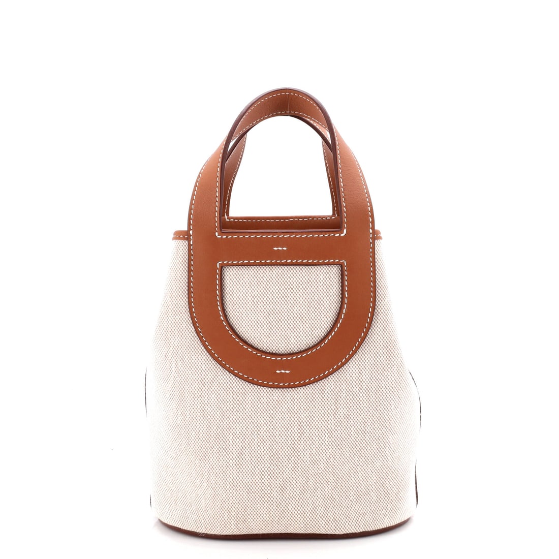 Hermes In-The-Loop Bag Canvas with Swift (18): The Hermes In-The-Loop Bag in Canvas with Swift reads with the calm authority the model has earned through repetition, at a 7 by 8 by 5 inch profile. Swift is Hermes's fine, smooth calfskin, light in 