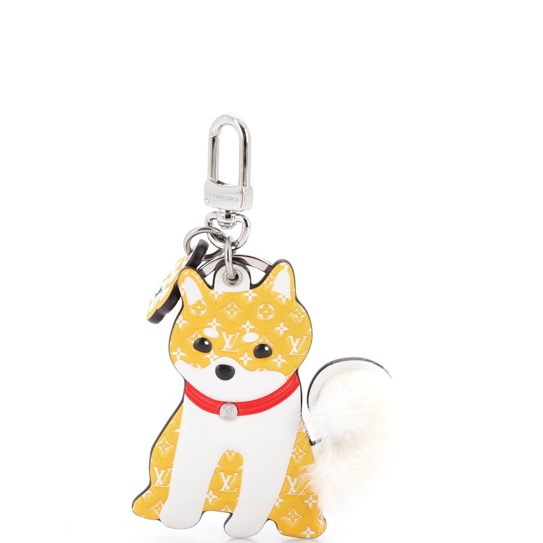 Louis Vuitton LV Animals Shiba Bag Charm and Key Holder Monogram Leather (2.5"W): The Louis Vuitton LV Animals Shiba Bag Charm and Key Holder in Monogram Leather, at a 2.5 inch wide profile carries the house's leather-goods discipline at a smaller register. Monogram Leather keeps t