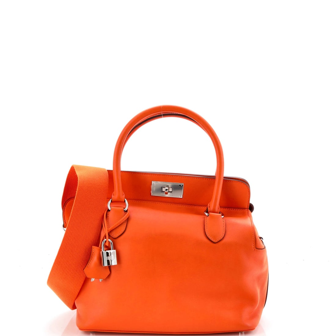 Hermes Toolbox Bag Swift (26): The Hermes Toolbox Bag in Swift is the model in its most architecturally legible reading. Swift is Hermes's fine, smooth calfskin, light in the hand and the variant most often chosen for color saturat