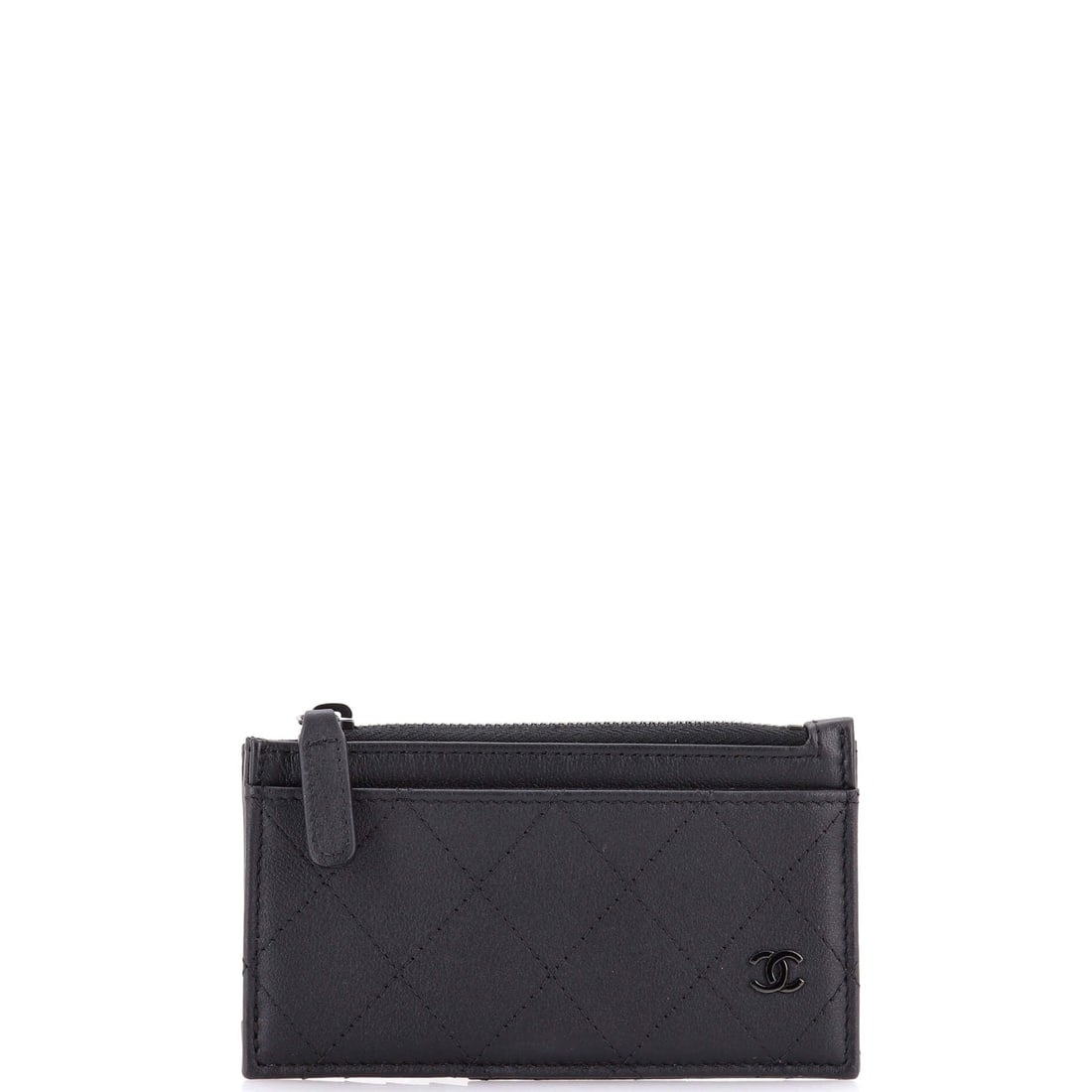 Chanel So Black CC Zip Card Holder Quilted Lambskin (5"W x 3"H x 1"D): The Chanel So Black CC Zip Card Holder in Quilted Lambskin is the small leather good that finishes the wardrobe rather than fills it. Lambskin is the softer, more luminous of Chanel's two main leather