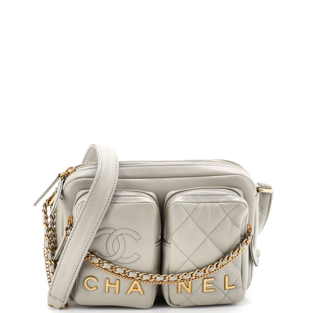 Chanel Logo Twin Pockets Chain Camera Case Quilted Calfskin (Small): The Chanel Logo Twin Pockets Chain Camera Case in Quilted Calfskin is the model in its boutique-floor configuration, at a 8 by 6 by 2.5 inch profile. The quilted calfskin finish photographs evenly acr