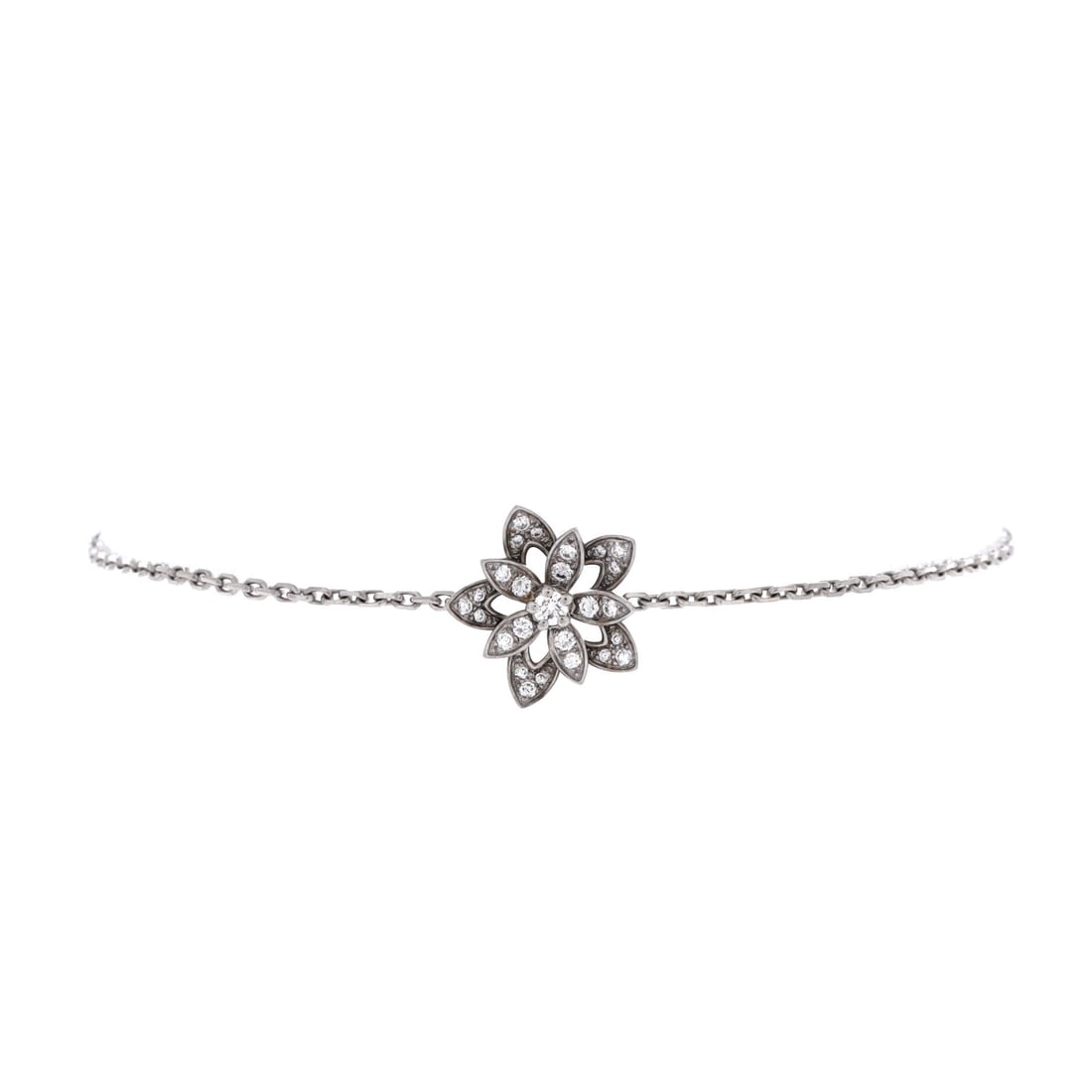 Van Cleef & Arpels Lotus Openwork Bracelet 18K White Gold with Diamonds (Mini): The Van Cleef & Arpels Lotus Openwork Bracelet in 18K White Gold with Diamonds offers the Van Cleef & Arpels signature at a scale built for daily wear and steady rotation. The 18k white gold with diam
