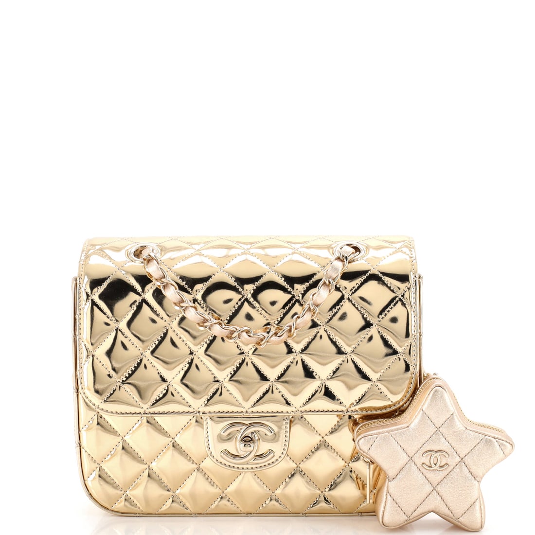 Chanel Hollywood Boulevard Backpack with Star Coin Purse Quilted Metallic Leather: The Chanel Hollywood Boulevard Backpack with Star Coin Purse in Quilted Metallic Leather reads as object as much as accessory, at a 8.5 by 7 by 2.5 inch profile, sized to be carried as a deliberate st