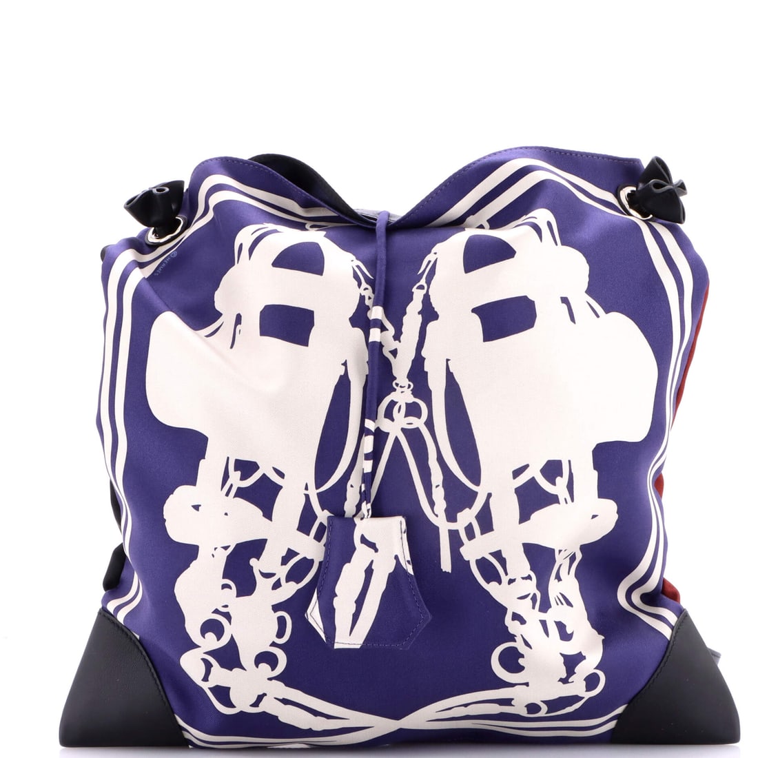 Hermes Silky City Bag Printed Silk and Leather (PM): The Hermes Silky City Bag in Printed Silk and Leather arrives at a 13 by 13 by 1 inch profile, the proportion the model wears most photogenically. The printed silk and leather hand falls between the s