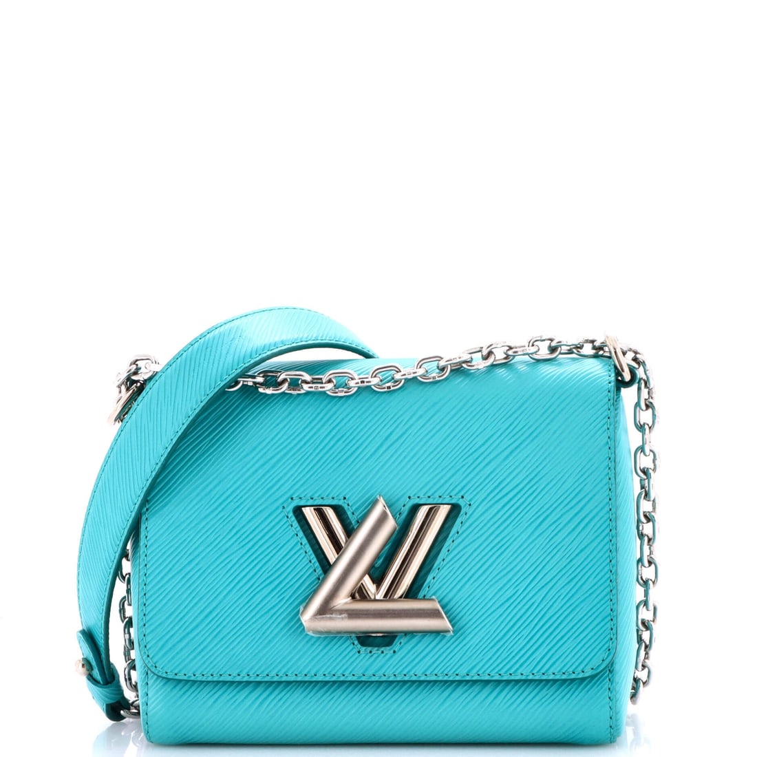 Louis Vuitton Twist Handbag Epi Leather (PM): The Louis Vuitton Twist Handbag in Epi Leather closes cleanly at the front, a small architectural moment that signals the model from across the room. Epi Leather is among the more deliberate reads in 