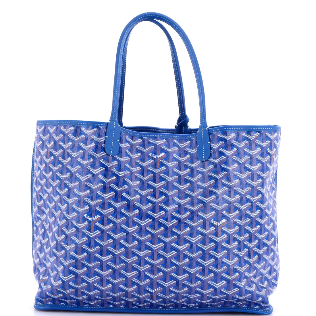 Goyard Anjou Reversible Tote Coated Canvas (PM): The Goyard Anjou Reversible Tote in Coated Canvas translates the model's architecture into a more saturated wardrobe register, in size PM. The coated canvas treatment keeps the bag's surface reading a