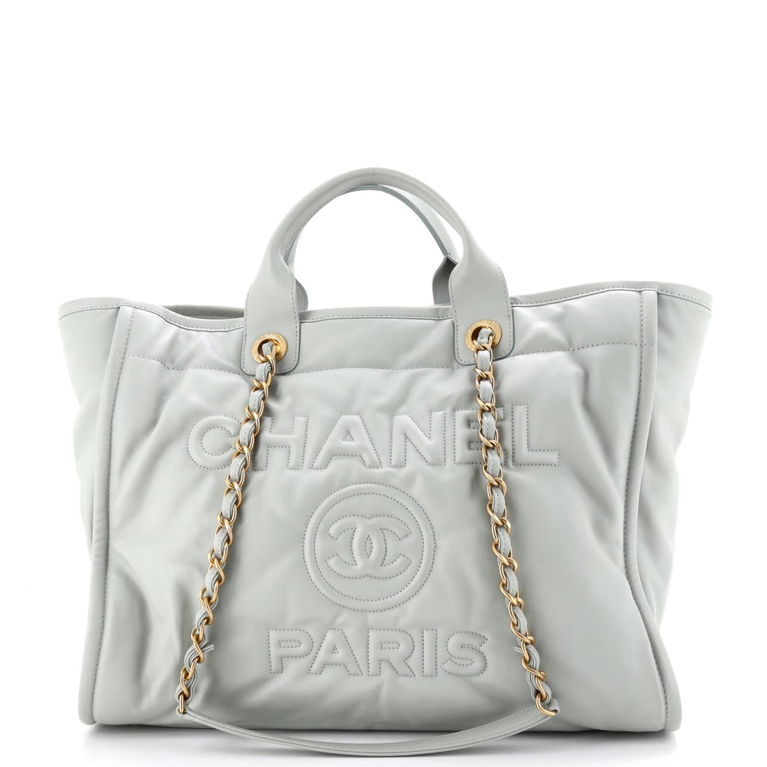 Chanel Deauville NM Tote Embossed Calfskin (Medium): The Chanel Deauville NM Tote in Embossed Calfskin is the model in its most architecturally legible reading, at a 15 by 12 by 7 inch profile. Few materials in the Chanel library wear in as cleanly as e