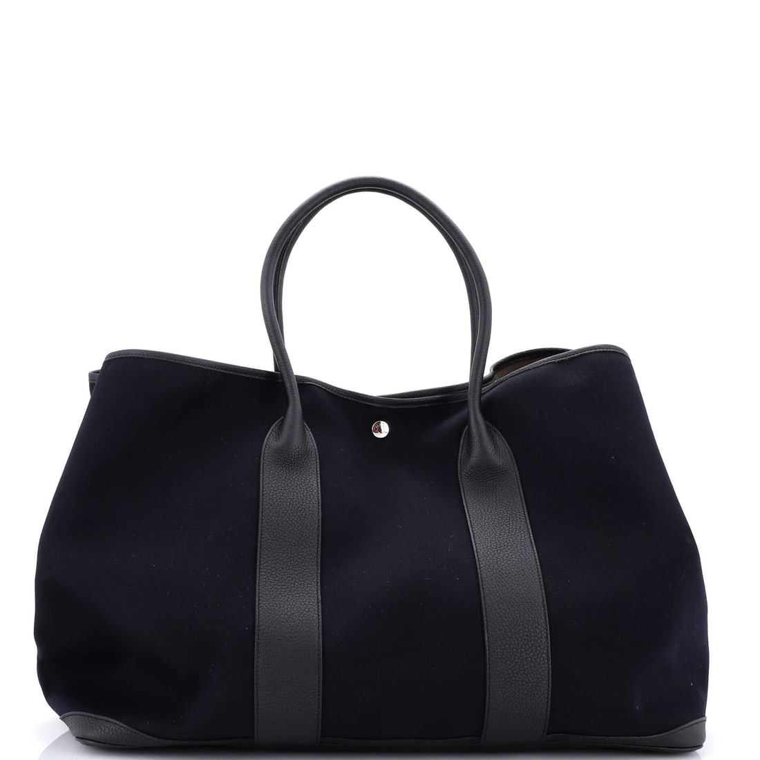 Hermes Garden Party Tote Toile and Leather (49): The Hermes Garden Party Tote in Toile and Leather offers the silhouette at a scale built for serious wardrobe rotation, in size 49. Toile is the tightly woven cotton-and-linen canvas Hermes runs on tr